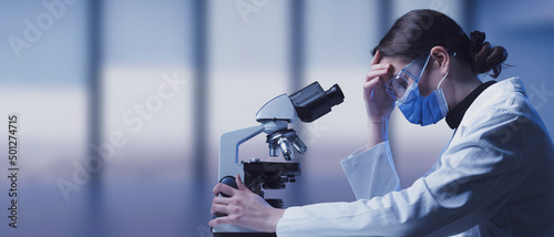 Leinwand Poster Pensive disappointed medical researcher in the lab