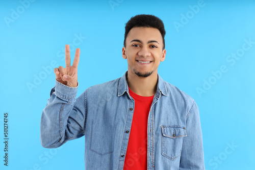 Concept of people with young man on blue background