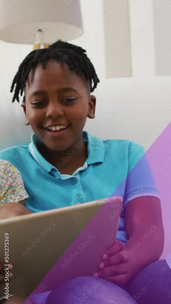 Animation of blue ribbon over african american siblings smiling and using tablet Animation of blue ribbon over african american siblings smiling and using tablet