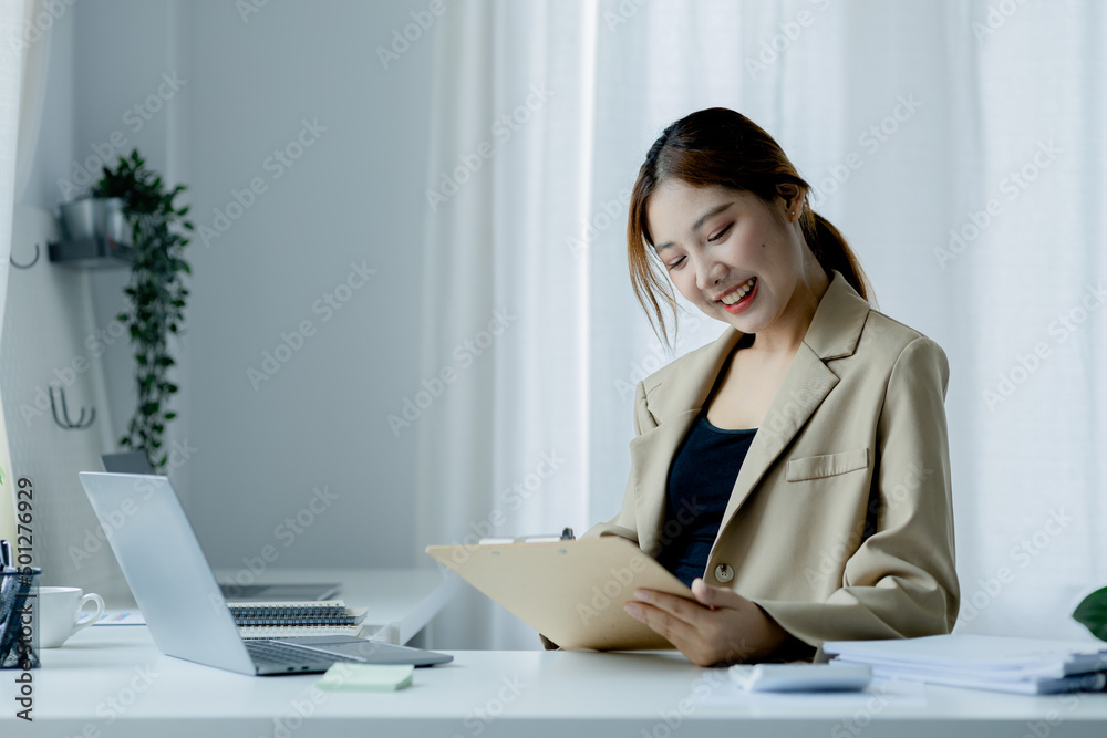 Asian women working in the office, young Asian business women as business executives, founding and running start-up executives, young female business leaders. Startup business concept. Asian women working in the office, young Asian business women as business executives, founding and running start-up executives, young female business leaders. Startup business concept.
