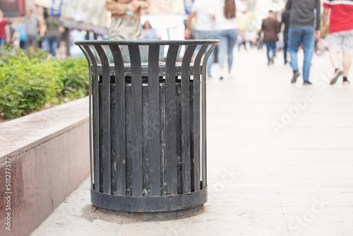 Metal trash bin in a city.