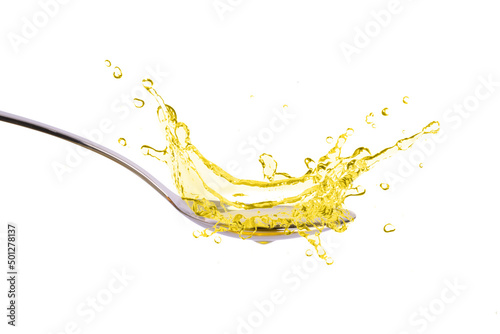 Wallpaper Mural Cooking oil splashing on stainless spoon isolated on white background. Torontodigital.ca