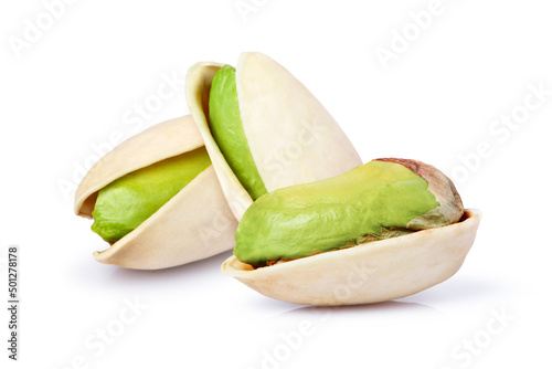 Closeup three Pistachio nuts isolated on white background. 