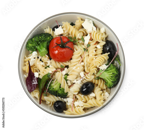 Bowl of delicious pasta with tomatoes, olives and broccoli on white background, top view