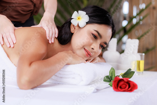 close up beautiful young asian woman lying relaxing in the spa salon massage, health and body care concept,