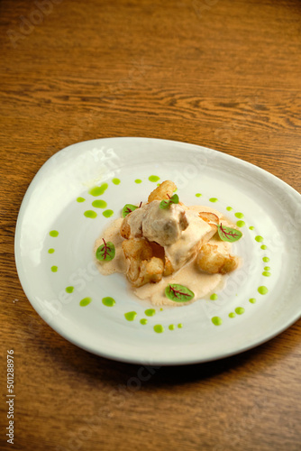 Chicken breast fillet with white sauce and olive oil