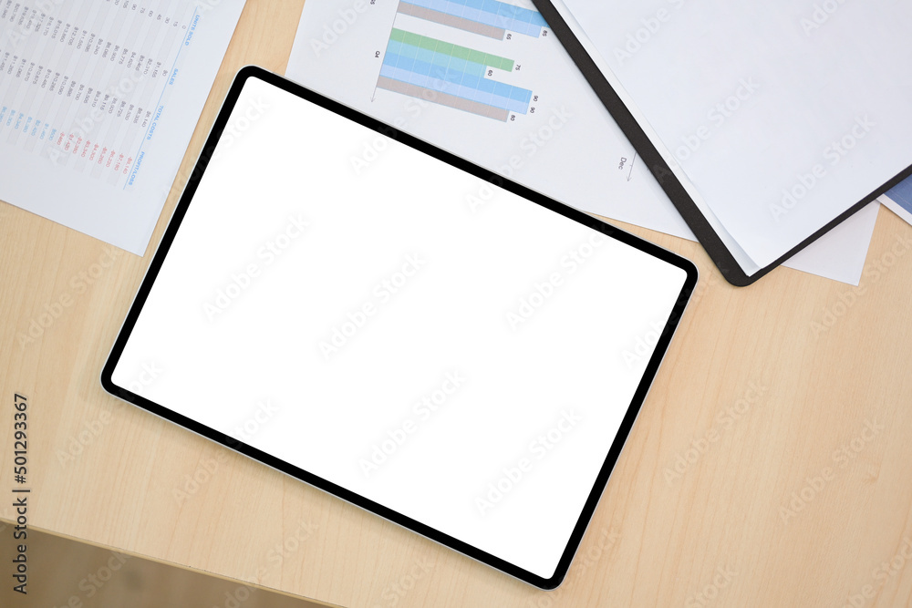 Top view, Digital tablet touchpad white screen mockup on the office desk. Top view, Digital tablet touchpad white screen mockup on the office desk.