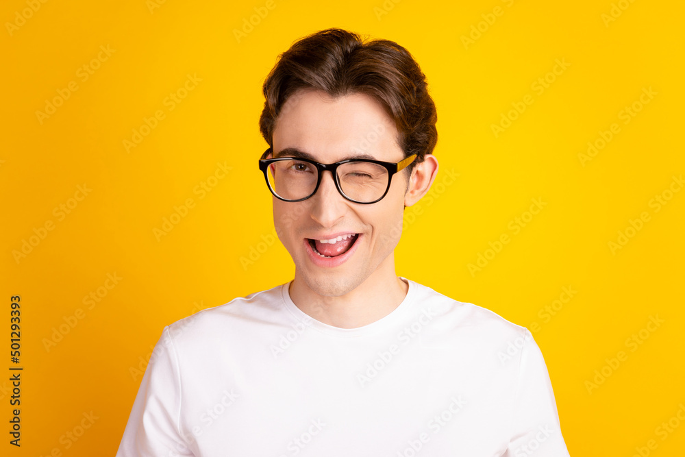 Photo of young handsome man good mood wink eye flirty date wear casual clothes isolated over yellow color background