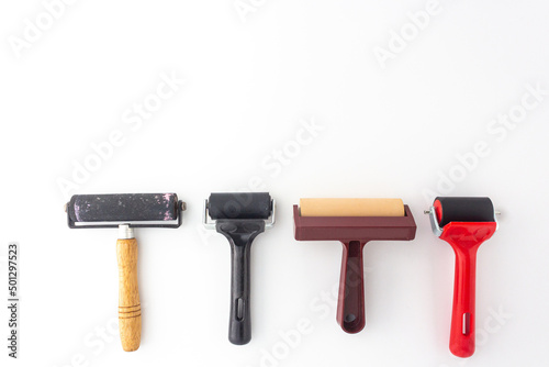 Collection of rubber brayers use in craft process on white background in top view. photo