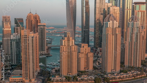 Skyscrapers of Dubai Marina near Sheikh Zayed Road with highest residential buildings morning timelapse