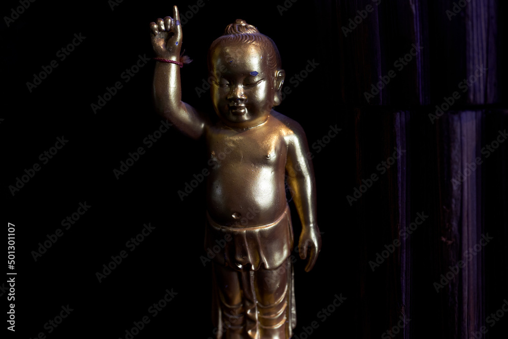 A small metal monk ornament ornament