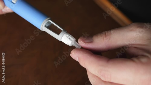 obese fat man preparing Semaglutide Ozempic injection to control blood sugar levels