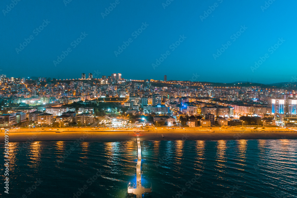 City and beach view taken with drone from Atakum district of Samsun in the evening. Atakum night scene and sunset 
