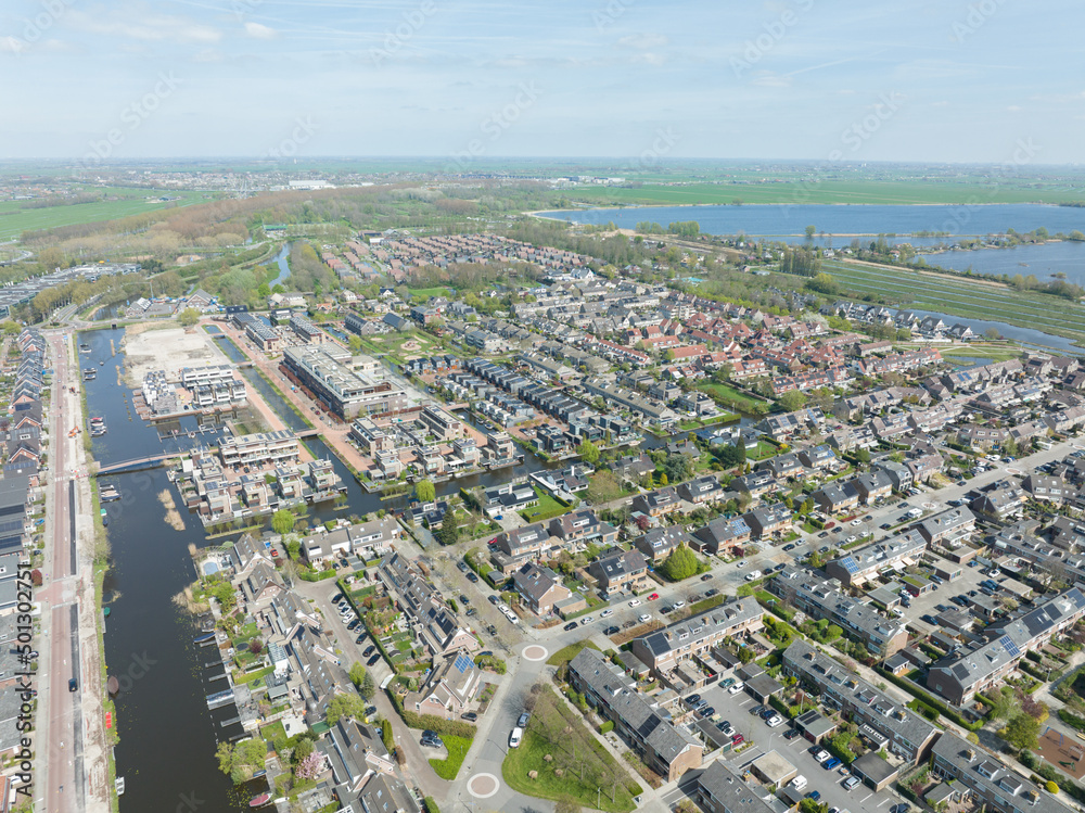 Modern suburb residential area household housing homes aerial drone view. new Build real estate european houses cityscape development of living space. Holland