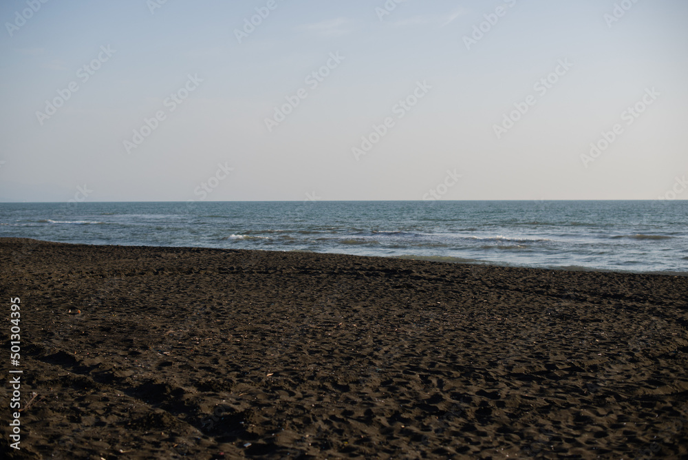 Ureki, Georgia, black sand on the beach sea Ureki, Georgia, black sand on the beach sea