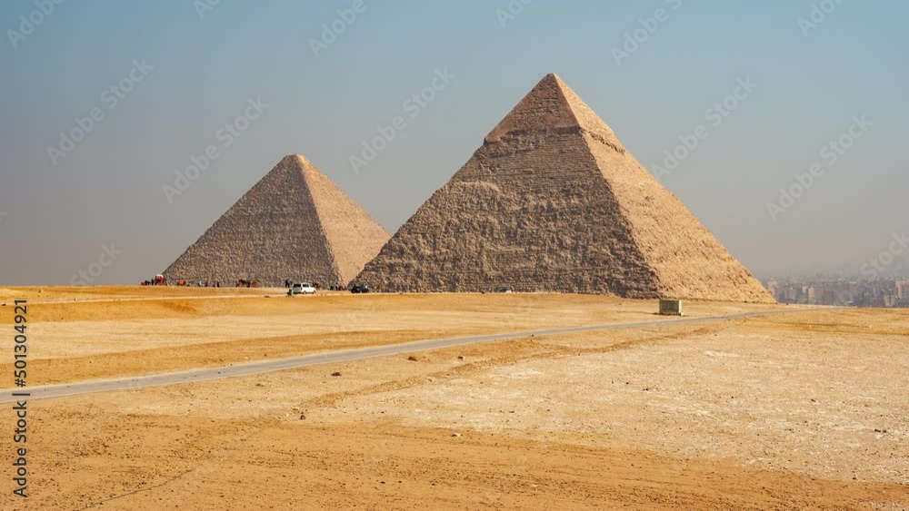 Daily life in Giza complex or necropolis with main pyramids (Great of Giza, of Khafre, of Menkaure). Timelapse. Tourists see landmarks of ancient Egypt on horseback, camels Daily life in Giza complex or necropolis with main pyramids (Great of Giza, of Khafre, of Menkaure). Timelapse. Tourists see landmarks of ancient Egypt on horseback, camels
