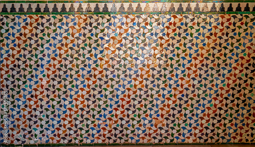 Colorful tiles in a medieval palace in Granada, Spain
