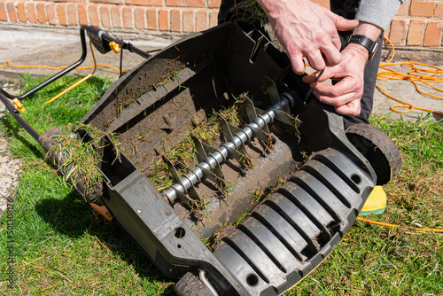 Electric Lawn scarifier. Work on green grass