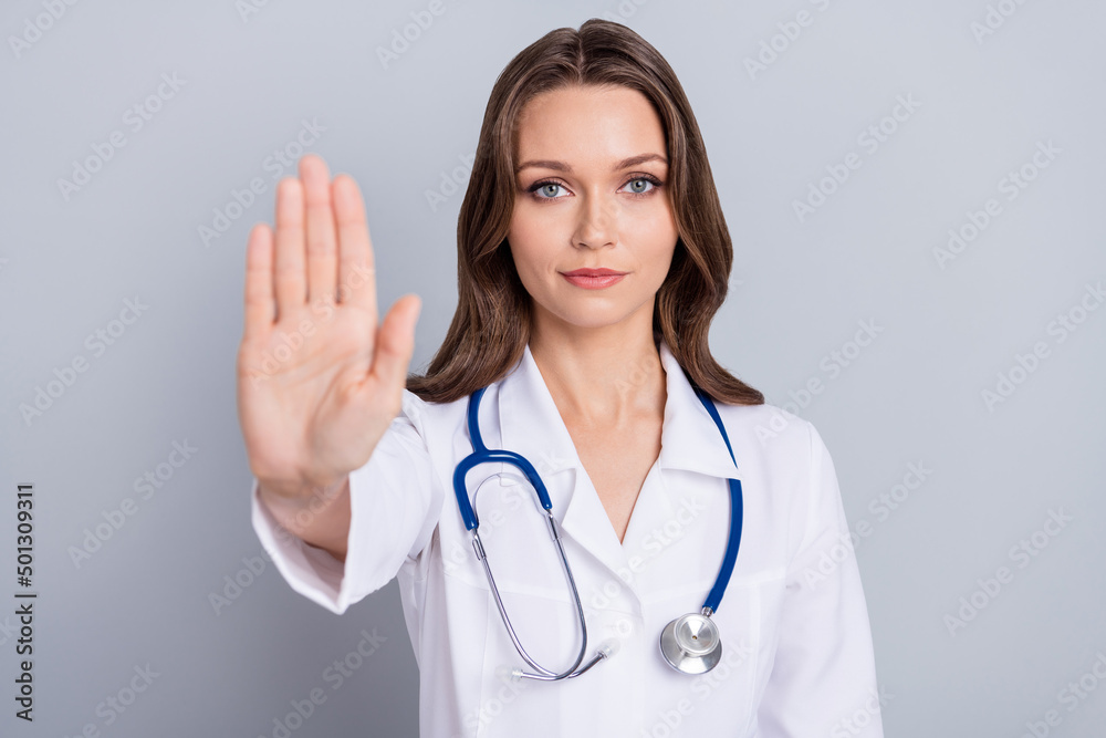 Photo of activist medic lady protest vax want stop covid spread show stop signal palm isolated grey color background Photo of activist medic lady protest vax want stop covid spread show stop signal palm isolated grey color background