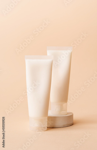 Cream tube mockup for branding presentation. Natural skincare beauty product on square white podium. Natural earthy colors
