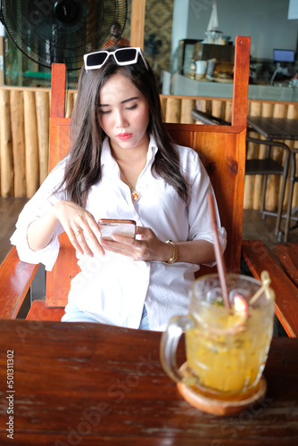 Girl using wifi in the cafe and restaurant