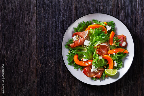 pumpkin salad with lettuce, crumbled cheese, ham