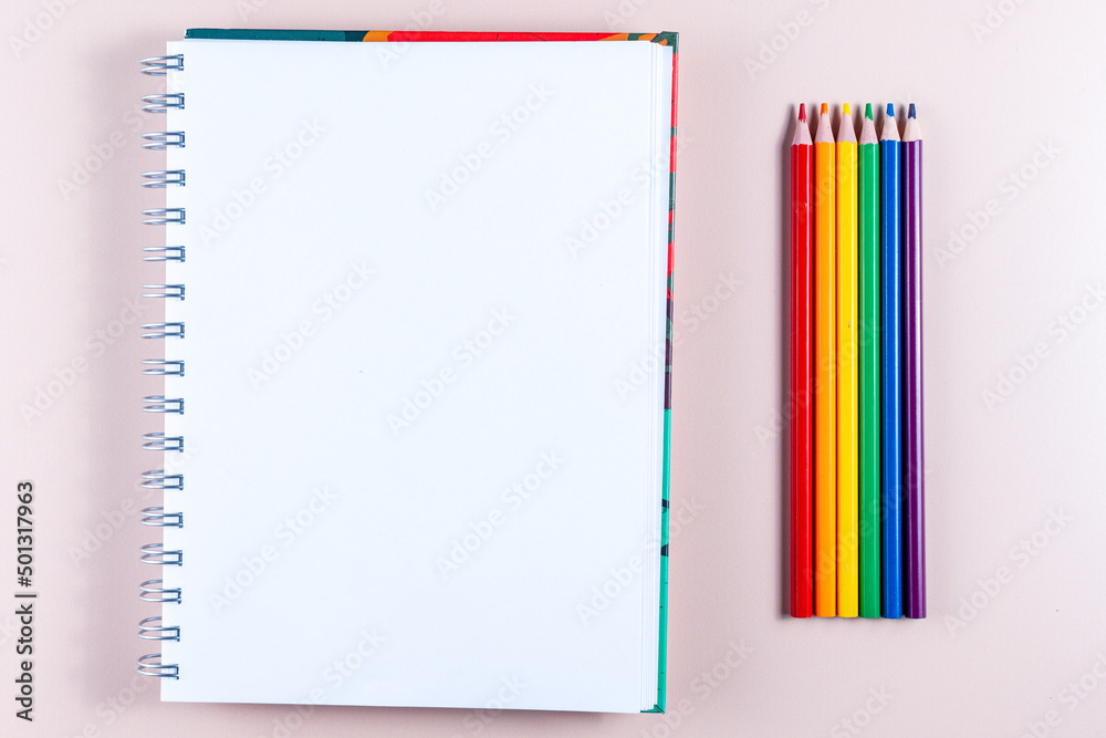 Pencils with the colors of the lgbt flag, a notepad and copy space. Pencils with the colors of the lgbt flag, a notepad and copy space.