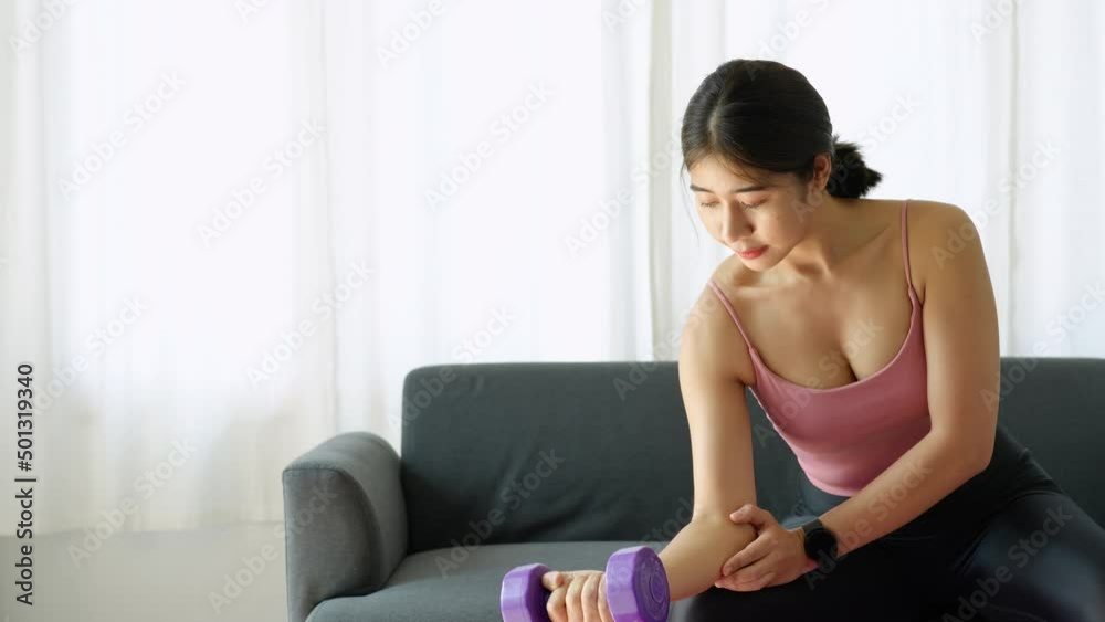 stress relief, , breathing exercises, meditation, portrait of Asian healthy woman lifting weights to strengthen her muscles after work. stress relief, , breathing exercises, meditation, portrait of Asian healthy woman lifting weights to strengthen her muscles after work.