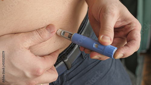 obese fat man injecting Semaglutide Ozempic injection control blood sugar levels
