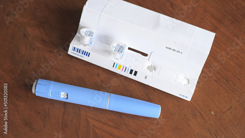 obese fat man preparing Semaglutide Ozempic injection control blood sugar levels