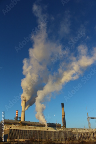 Pollution.industry metallurgical plant dawn smoke smog emissions bad ecology. © Ionelia