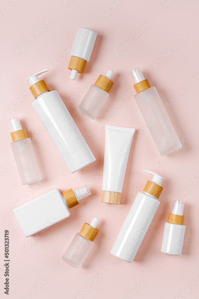 Cosmetic container mockups for branding and packaging presentation. Pump bottle, cream tube, and dropper on pastel background. Natural skincare beauty product concept. Cosmetic container mockups for branding and packaging presentation. Pump bottle, cream tube, and dropper on pastel background. Natural skincare beauty product concept.