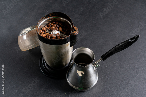 Roasted coffee beans in a coffee grinder
