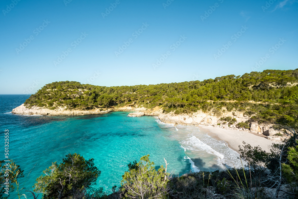View of Mitjaneta beach with beautiful turquoise seawater, Menorca island, Spain
