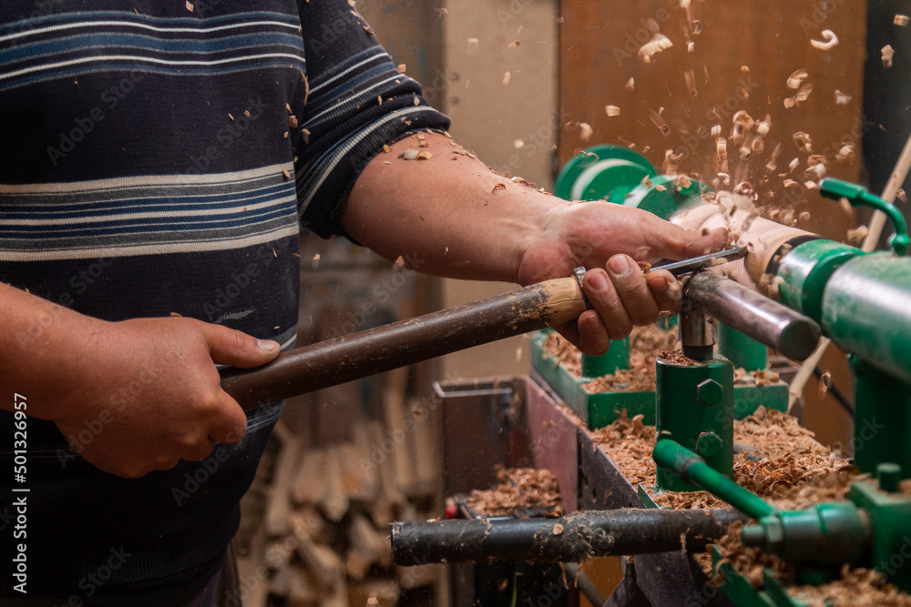 Carpenter turning wood on a lathe Carpenter turning wood on a lathe