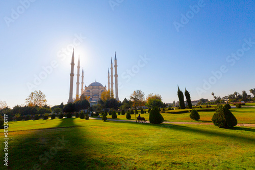 Sabanci Central Mosque (Turkish: Sabanci Merkez Cami) and Seyhan River in Adana, Turkey. Turkey's largest mosque with blue sky. photo