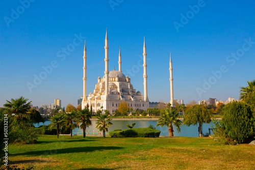 Sabanci Central Mosque (Turkish: Sabanci Merkez Cami) and Seyhan River in Adana, Turkey. Turkey's largest mosque with blue sky. photo