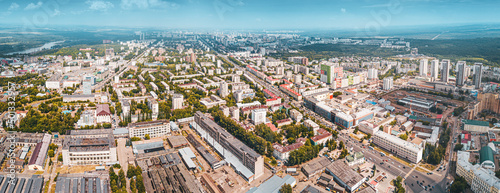 Aerial view of urban skyline of a modern city with site development and busy crossroads and streets