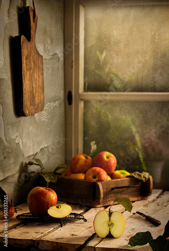 Fine Art Photography. Apples in old kitchen in a rainy day.