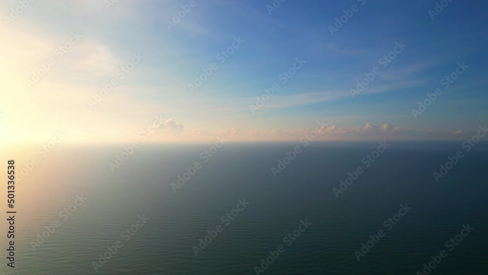 4K aerial view from a drone, tropical seas. The orange sunlight reflects the beautiful sea waves.
4K aerial view from a drone, tropical seas. The orange sunlight reflects the beautiful sea waves.