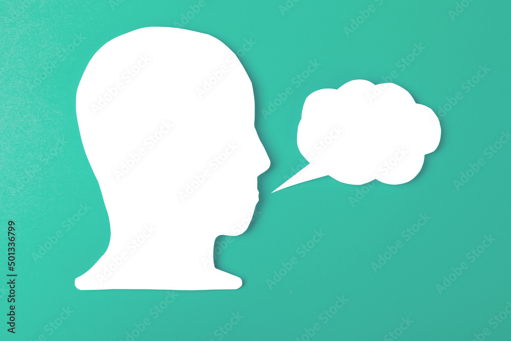  paper face and speech bubble on colorbackground copy space for text, communication, symbolic- Image