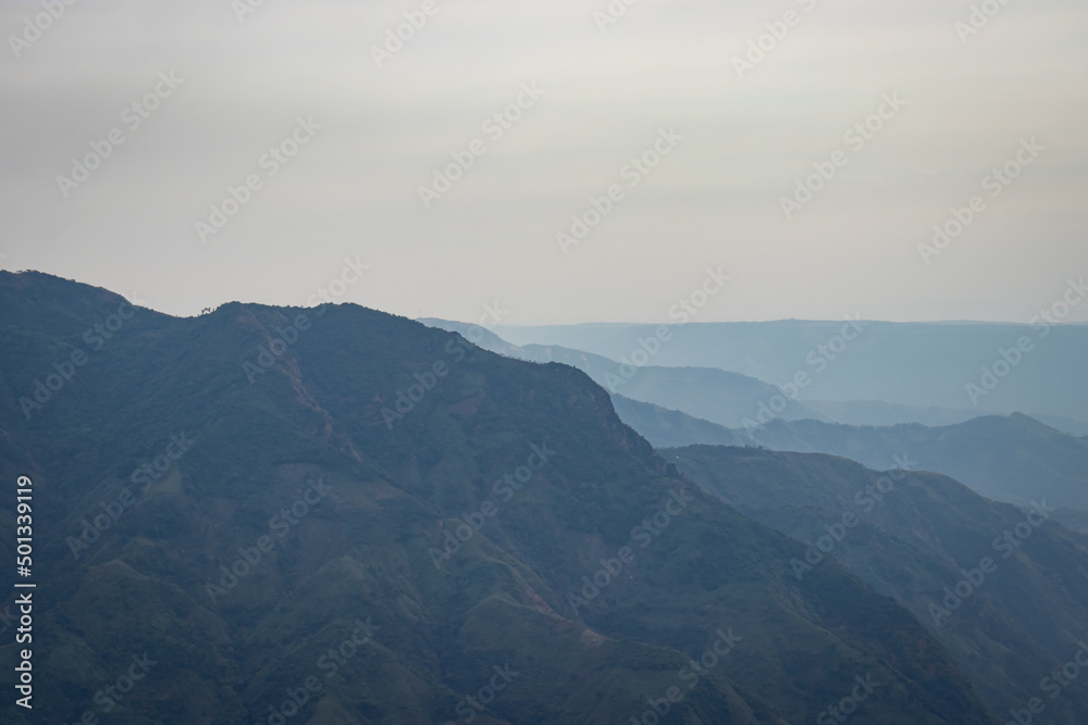 mountain valley covered with white mists and haze at morning from flat angle mountain valley covered with white mists and haze at morning from flat angle