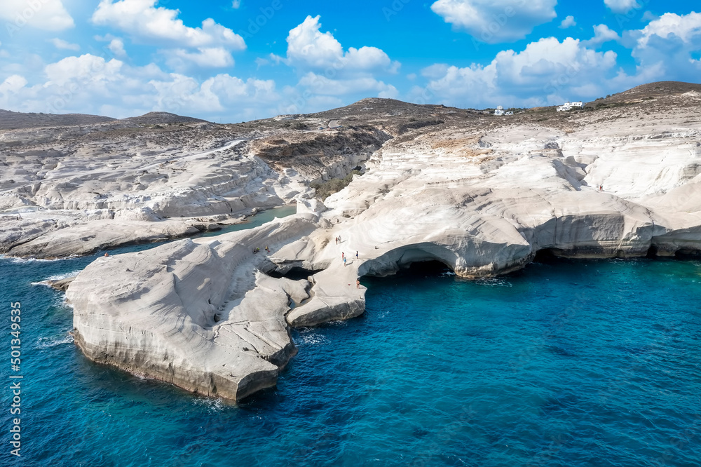 Beautiful aerial morning view of the famous rock formations at Sarakiniko, Milos island, Cyclades, Greece, with white chalk cliffs and turquoise sea Beautiful aerial morning view of the famous rock formations at Sarakiniko, Milos island, Cyclades, Greece, with white chalk cliffs and turquoise sea