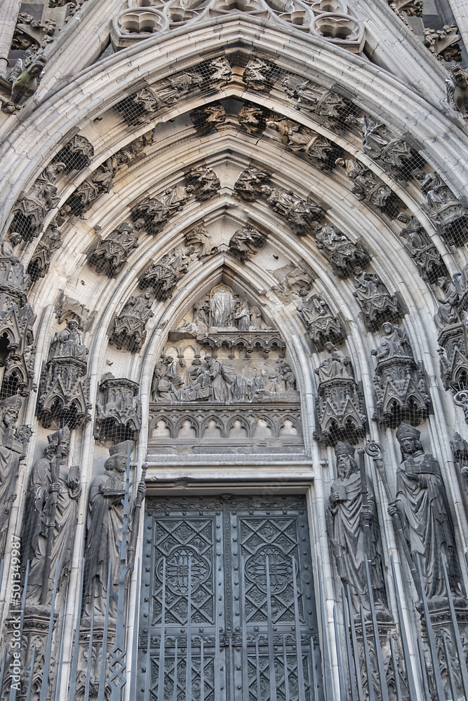 Details of Cologne cathedral (Cathedral Church of Saint Peter, from 1248). Cologne Cathedral - High Gothic five-aisled basilica, with a projecting transept and a tower facade. Cologne, Germany.