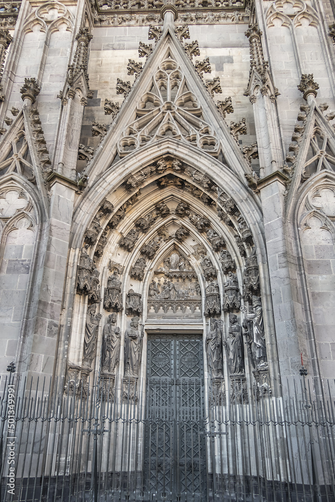 Details of Cologne cathedral (Cathedral Church of Saint Peter, from 1248). Cologne Cathedral - High Gothic five-aisled basilica, with a projecting transept and a tower facade. Cologne, Germany. Details of Cologne cathedral (Cathedral Church of Saint Peter, from 1248). Cologne Cathedral - High Gothic five-aisled basilica, with a projecting transept and a tower facade. Cologne, Germany.