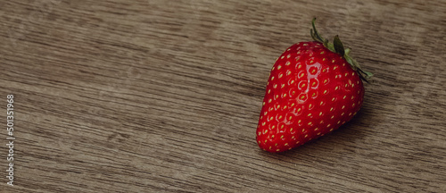 Fresh juicy premium strawberries on natural wooden background. Tochiotome Japanese strawberry. photo