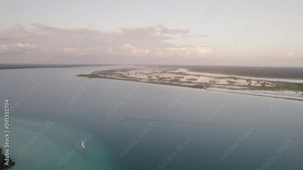 Picturesque Bacalar With Calm Blue Waters At Sundown In Quintana Roo, Mexico. aerial Picturesque Bacalar With Calm Blue Waters At Sundown In Quintana Roo, Mexico. aerial