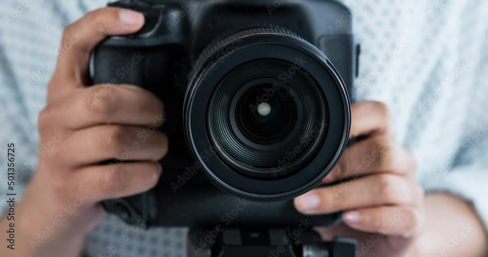 Animation of caucasian woman holding camera over white background Animation of caucasian woman holding camera over white background
