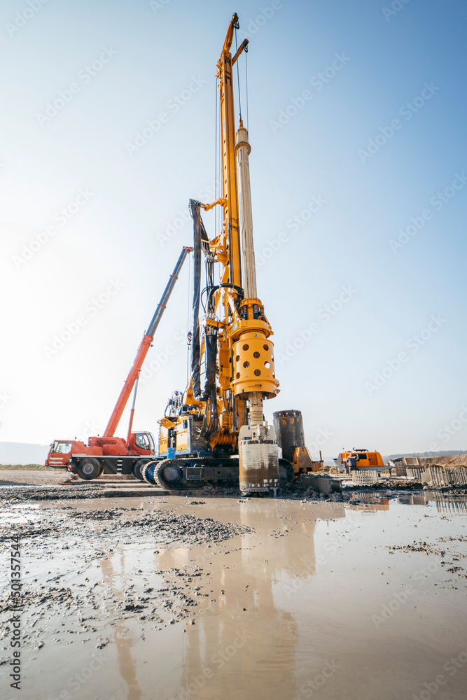 Drilling rig on a construction site. Drilled piles for the bridge foundation.
Drilling rig on a construction site. Drilled piles for the bridge foundation.