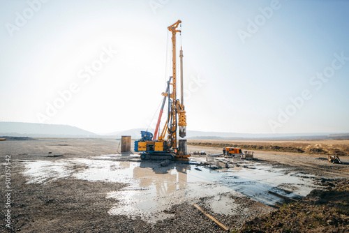 Drilling rig on a construction site. Drilled piles for the bridge foundation. 